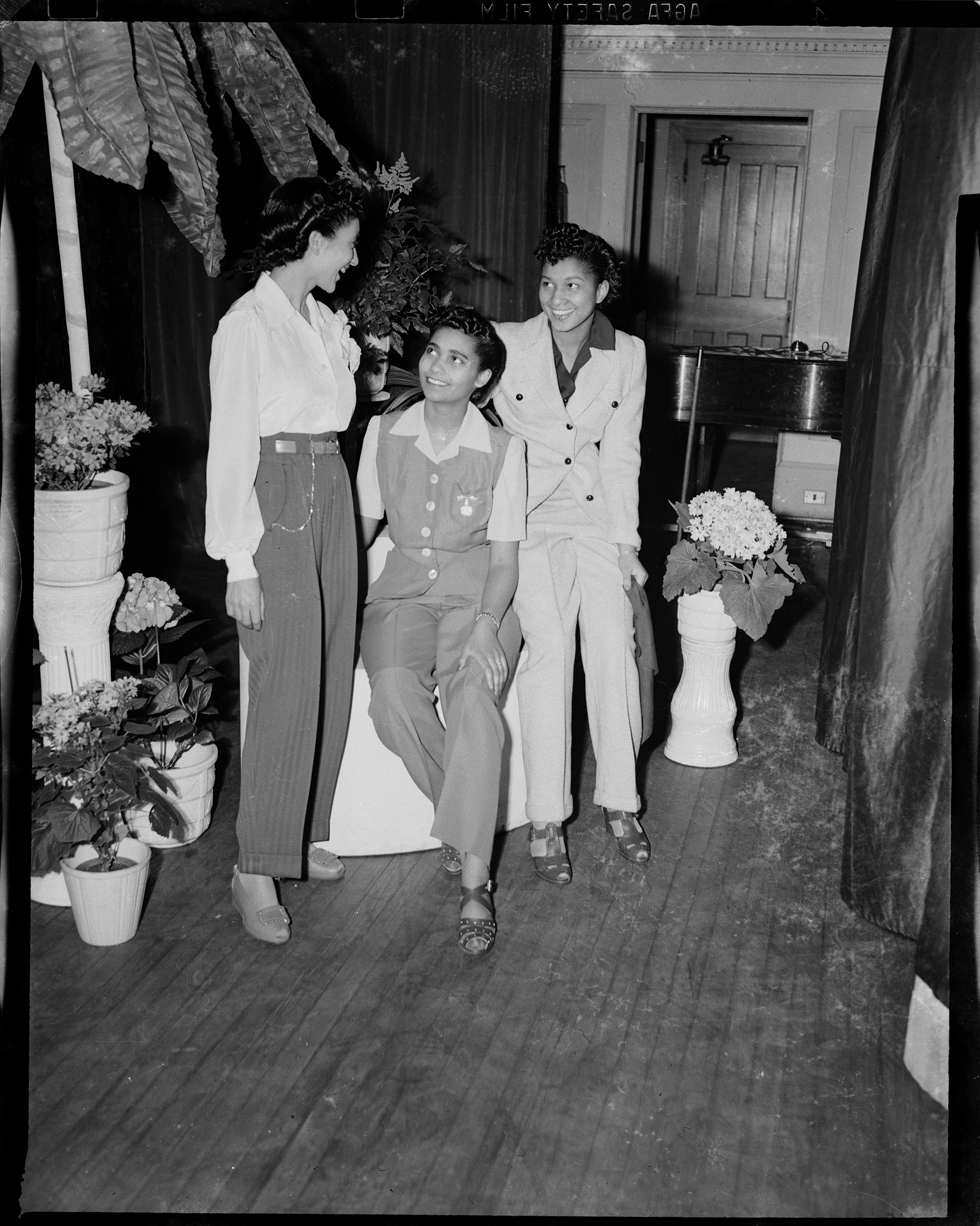     Charles “Teenie” Harris, Three women wearing pants, pictured at the Beauty Shop Owners&#8217; Fashion Review in Schenley High School, 1945. Silver Gelatin print. Courtesy of Carnegie Museum of Art, Pittsburgh.

