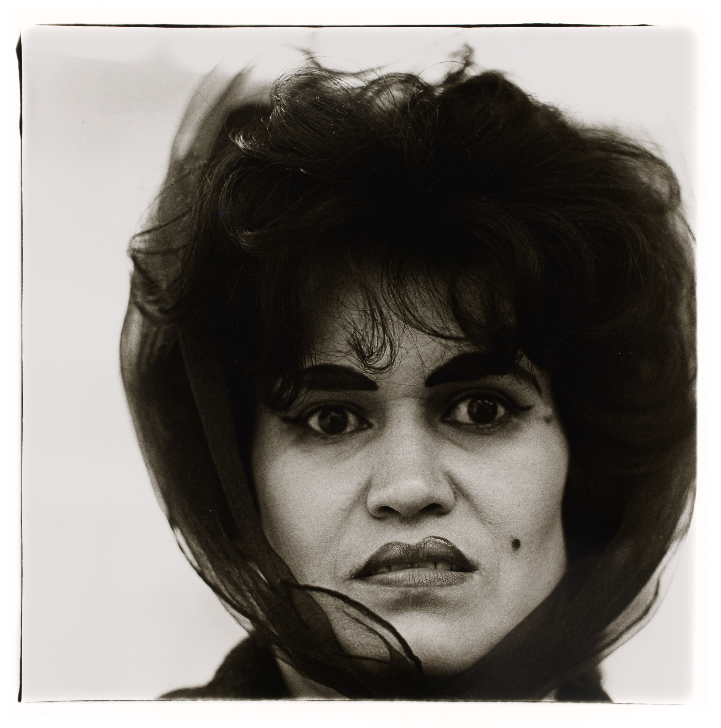     Diane Arbus, Puerto Rican woman with a beauty mark, N.Y.C., 1965. Gelatin silver print, sheet: 50.8 x 40.6 cm. Art Gallery of Ontario. Gift of Phil Lind, 2016. Copyright © Estate of Diane Arbus.

