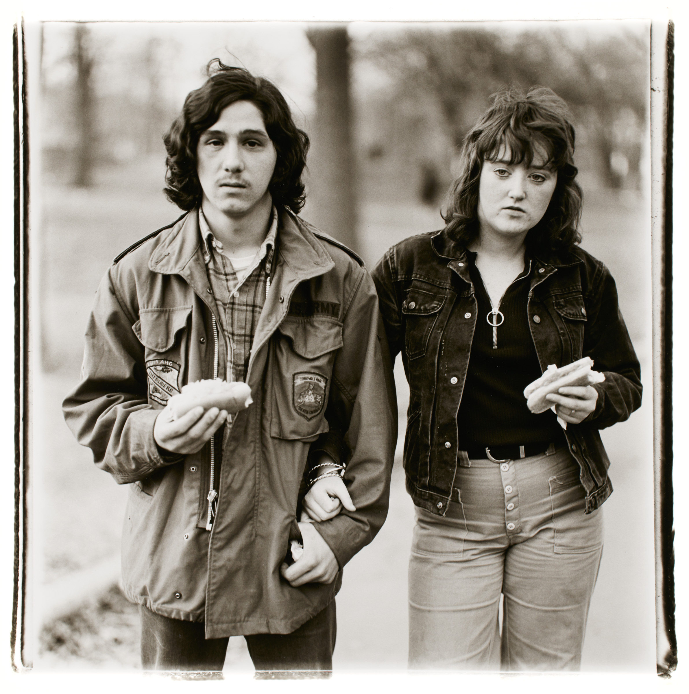     Diane Arbus, A young man and his girlfriend with hot dogs in the park, N.Y.C., 1971. Gelatin silver print, sheet: 50.8 x 40.6 cm. Art Gallery of Ontario. Gift of Jay Smith, 2016. Copyright © Estate of Diane Arbus.

